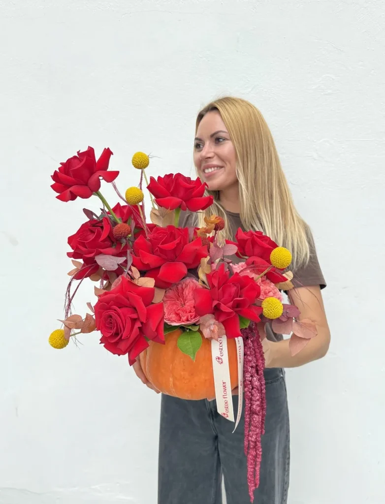 Fall flower arrangement in a pumpkin with roses and eucalyptus 2