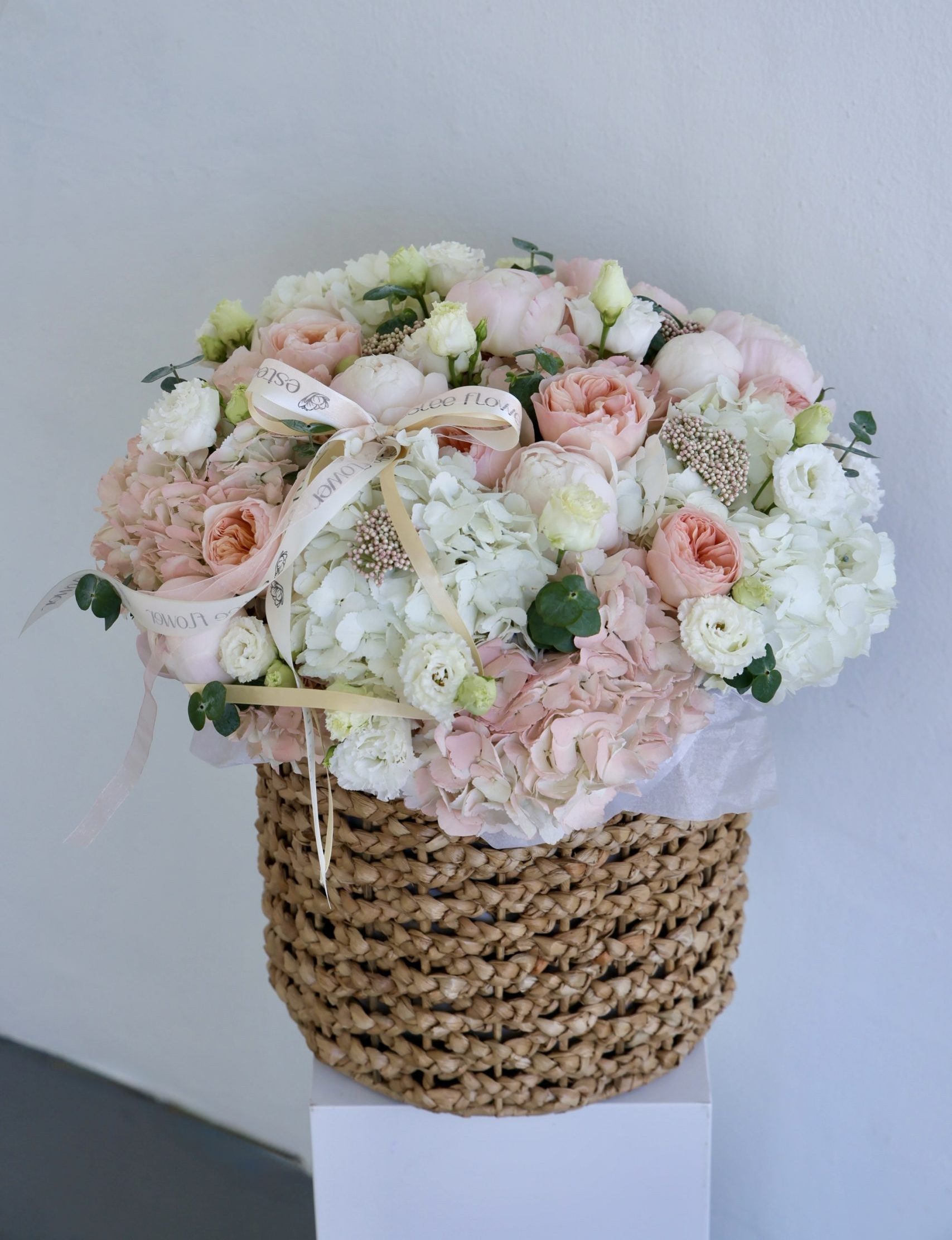 basket of ruth shavuot arrangement with peonies and garden roses
