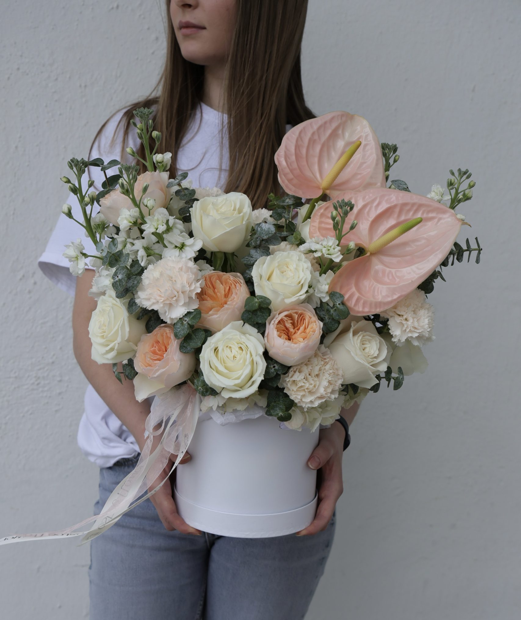 blush elegance arrangement in a hat box with anthuriums, garden roses and stock