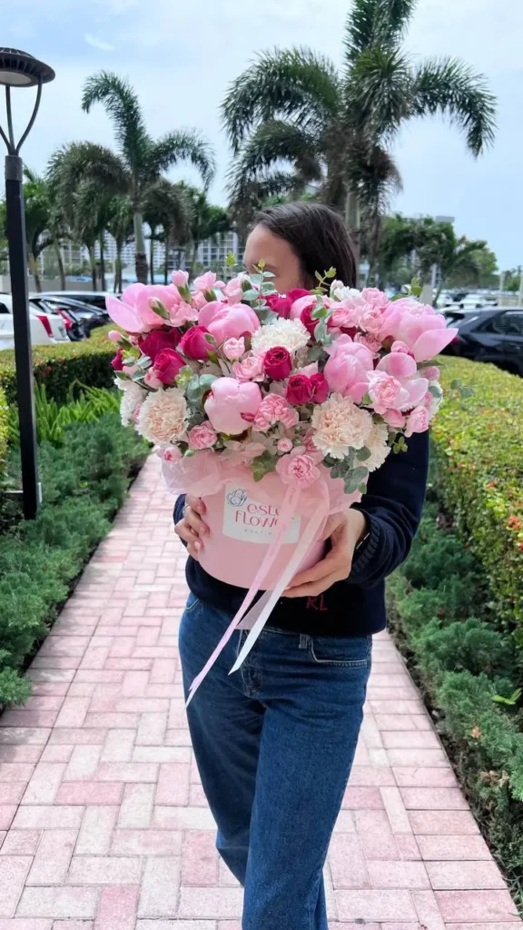 Flowers in a hat box Euphoria with peonies, spray roses, and carnations