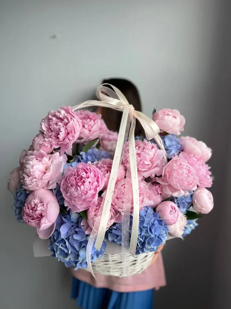 Hydrangeas and peonies basket arrangement with Dutch hydrangeas and pink peonies
