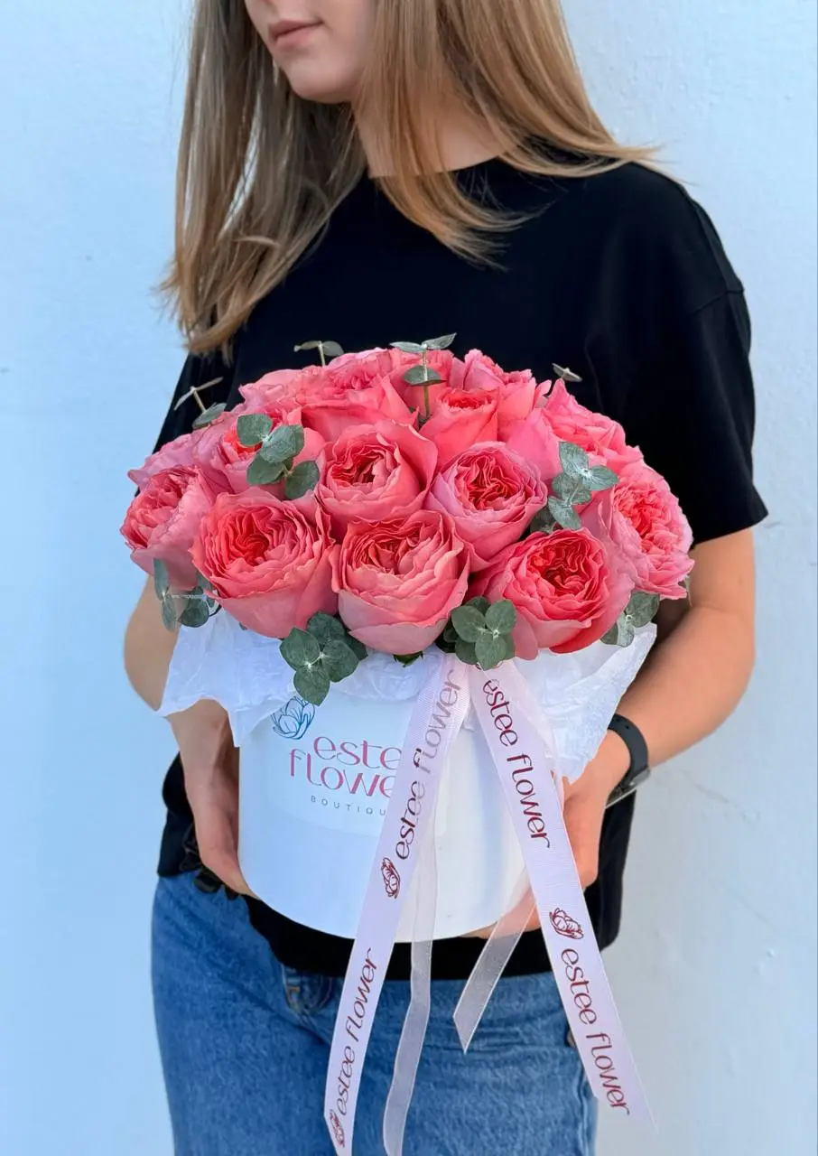 Pink Xpression in a hat box with Garden Roses and Eucalyptus