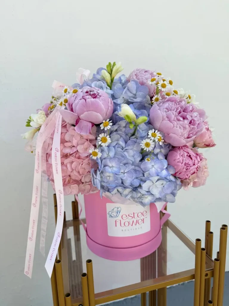 Flowers in a hat box Sweet June with peonies and hydrangeas